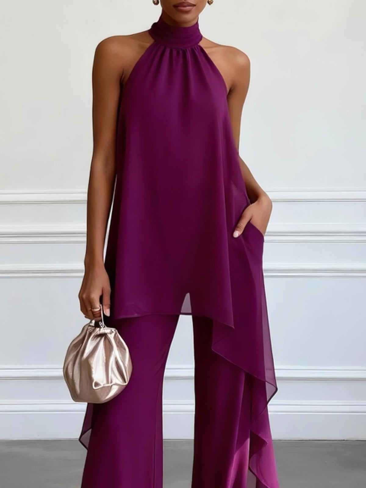 Top elegante sin mangas morado con pantalones