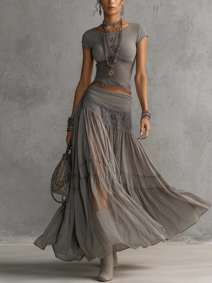 Top gris transparente con paneles de encaje y conjunto de falda