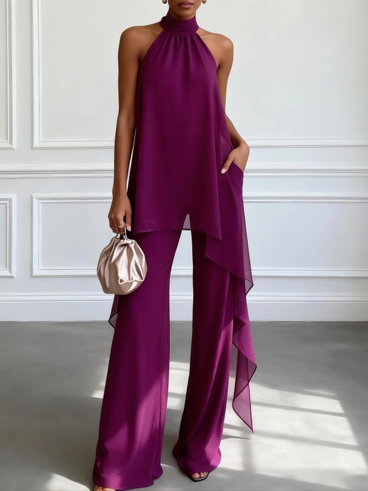 Top elegante sin mangas morado con pantalones
